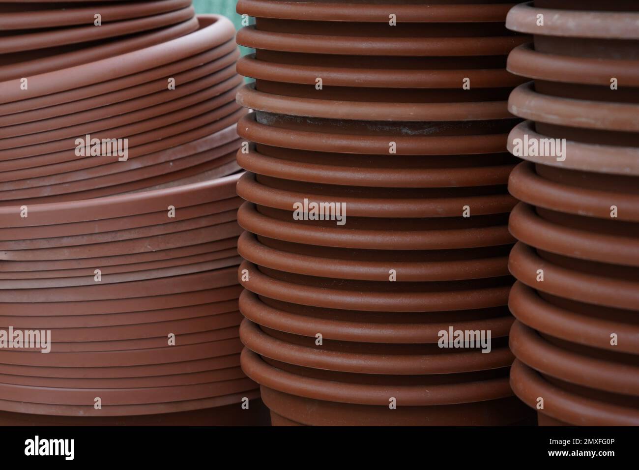 Plastic plant pots and trays stocked making out a background Stock