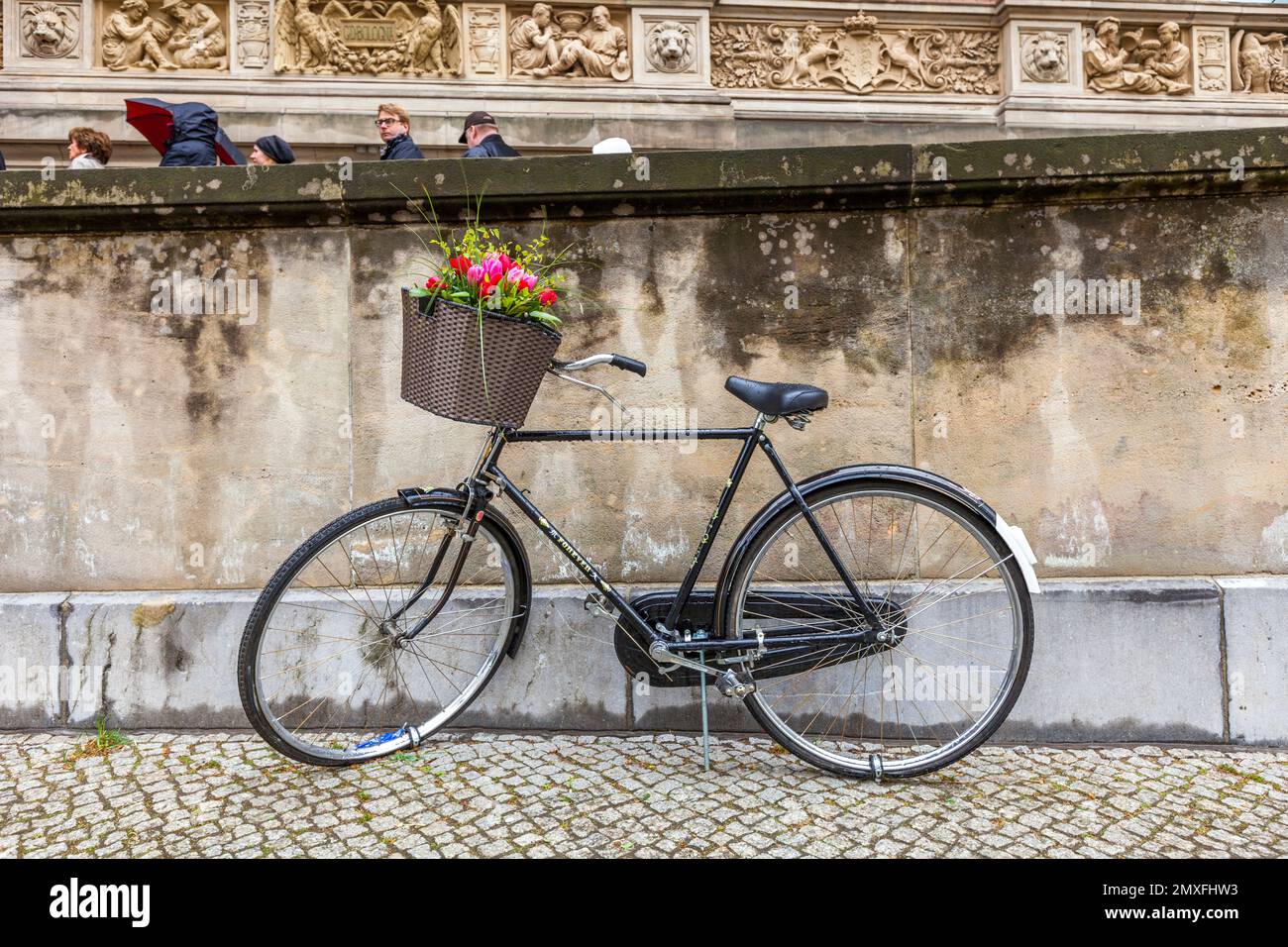 The bicycle of the Chinese artist Ai Wai Wai stands in Berlin in front of the Gropiusbau and has fresh flowers every day. Berlin, Germany Stock Photo