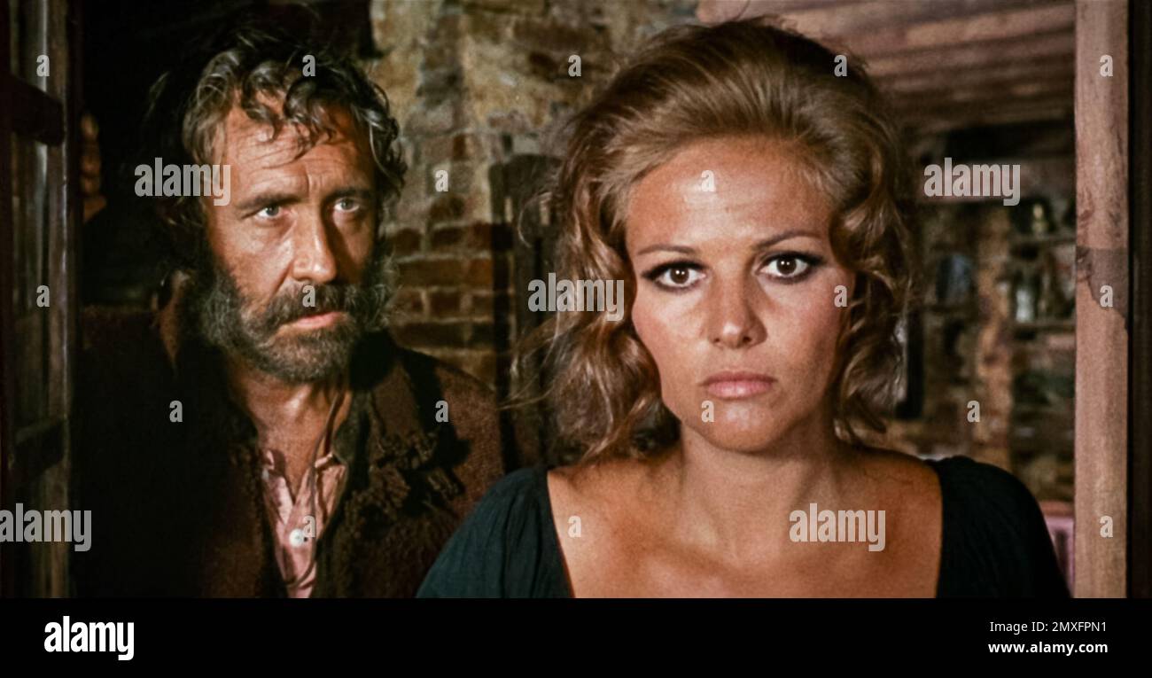 USA. Jason Robards and Claudia Cardinale in a scene from the (C)Paramount  film: Once Upon a Time in the West (1968). Plot: A mysterious stranger with  a harmonica joins forces with a