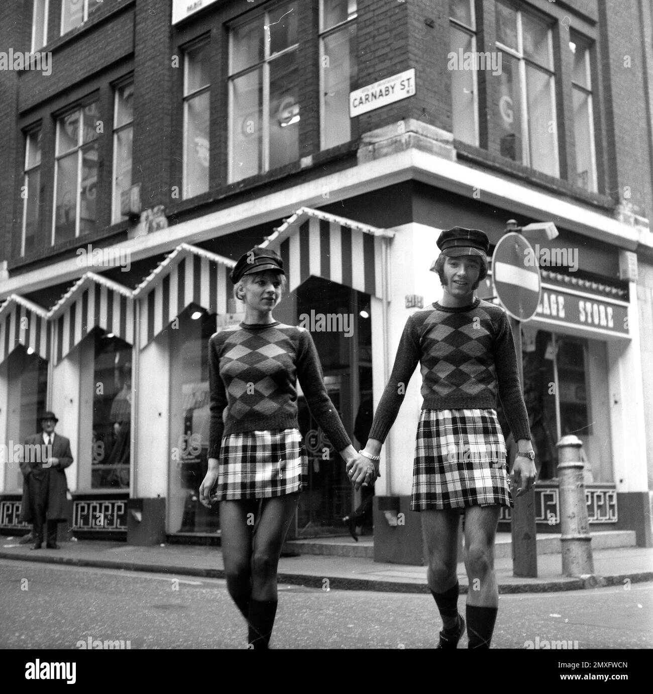 His and hers fashion in Carnaby Street, London 1968 Stock Photo