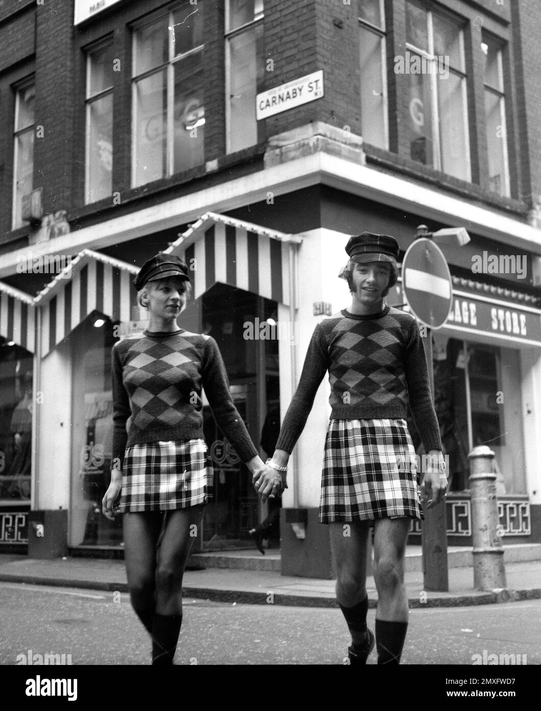 His and hers fashion in Carnaby Street, London 1968 Stock Photo