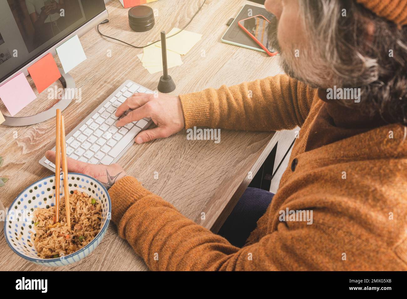 Employee eating in the office Stock Photo