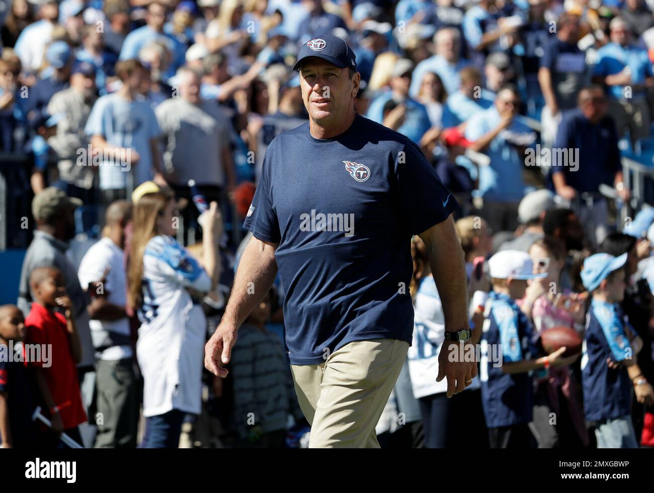 Tennessee Titans head coach Mike Mularkey watches players warm up