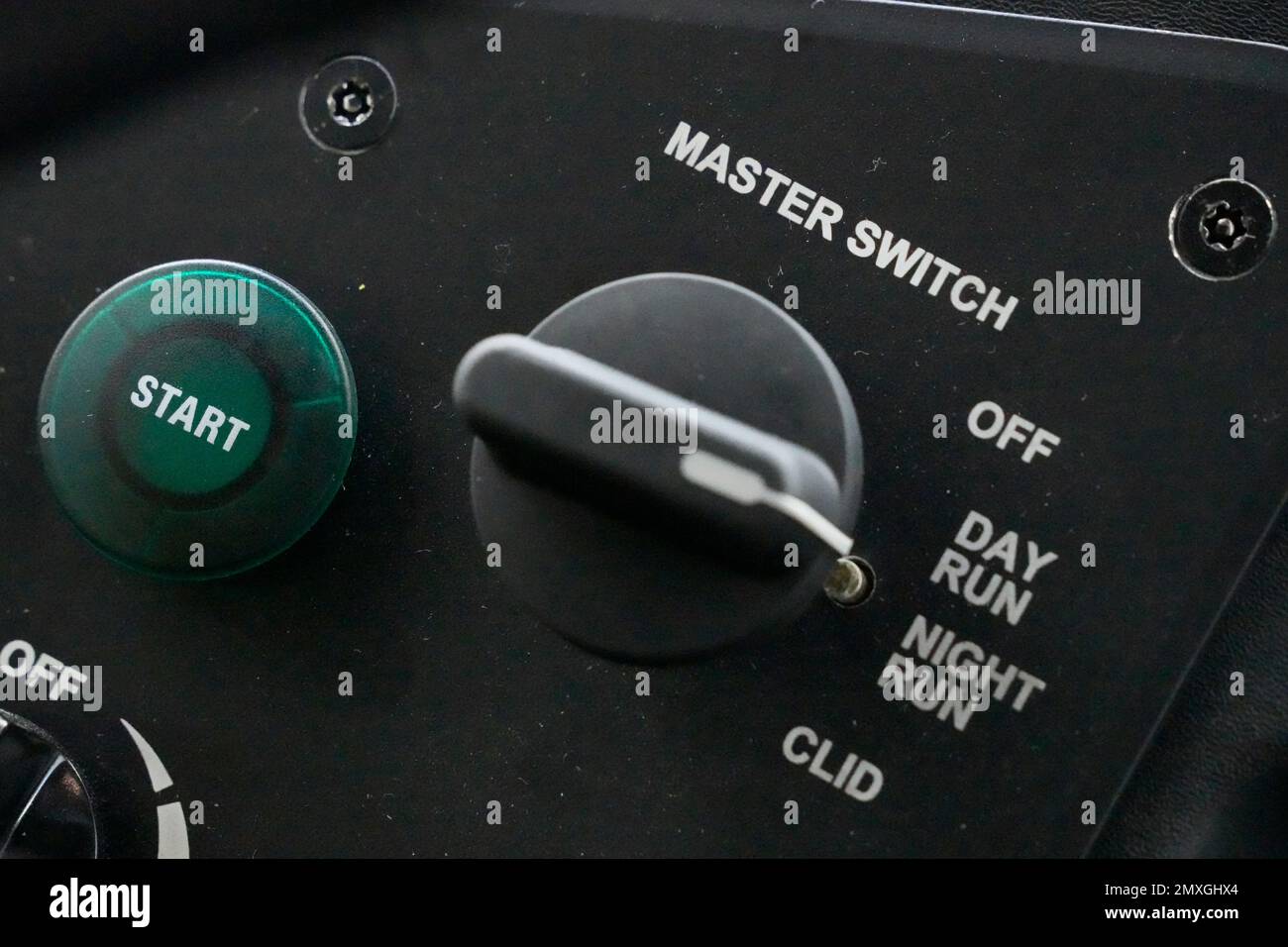The start button on a new battery-powered bus, left, is shown parked at ...
