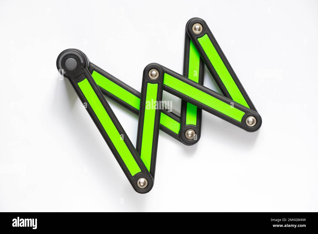 segmented anti-theft bicycle lock on white background close-up Stock Photo