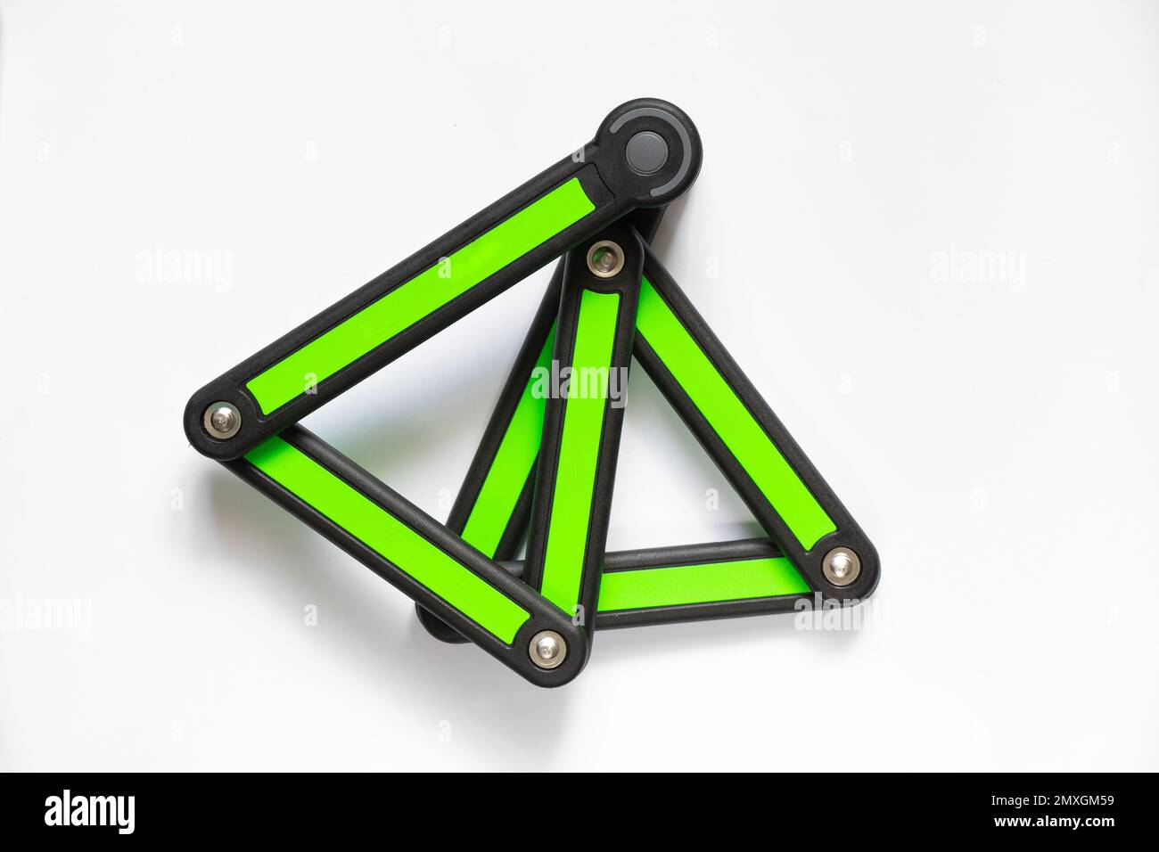 segmented anti-theft bicycle lock on white background close-up Stock Photo