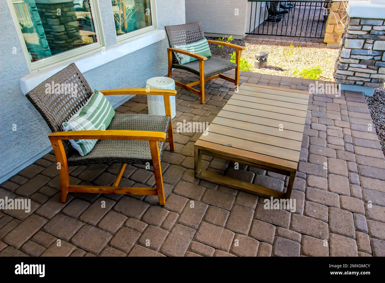 Front Pavers Patio With Two Arm Chairs Stock Photo - Alamy