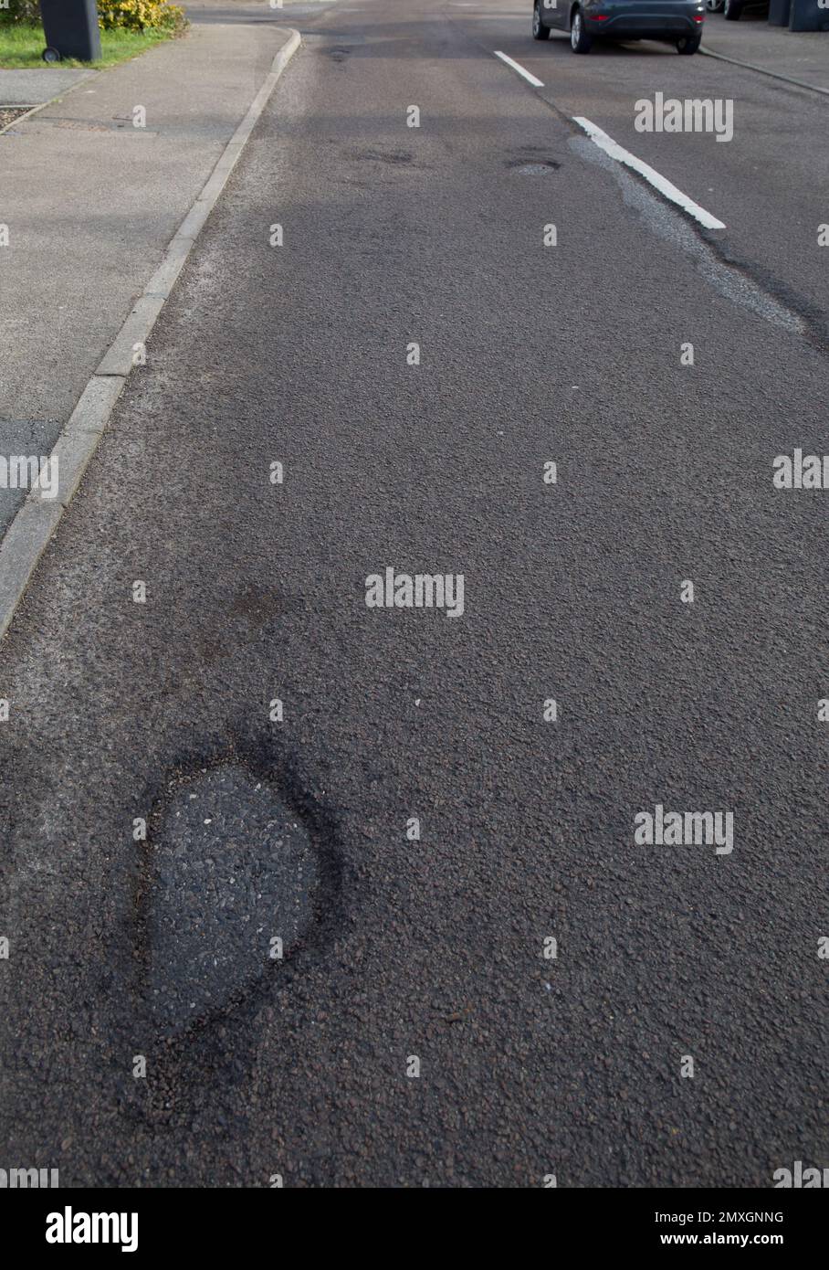 Pot Holes Potholes in Road Surface Church Langley Harlow Essex Stock