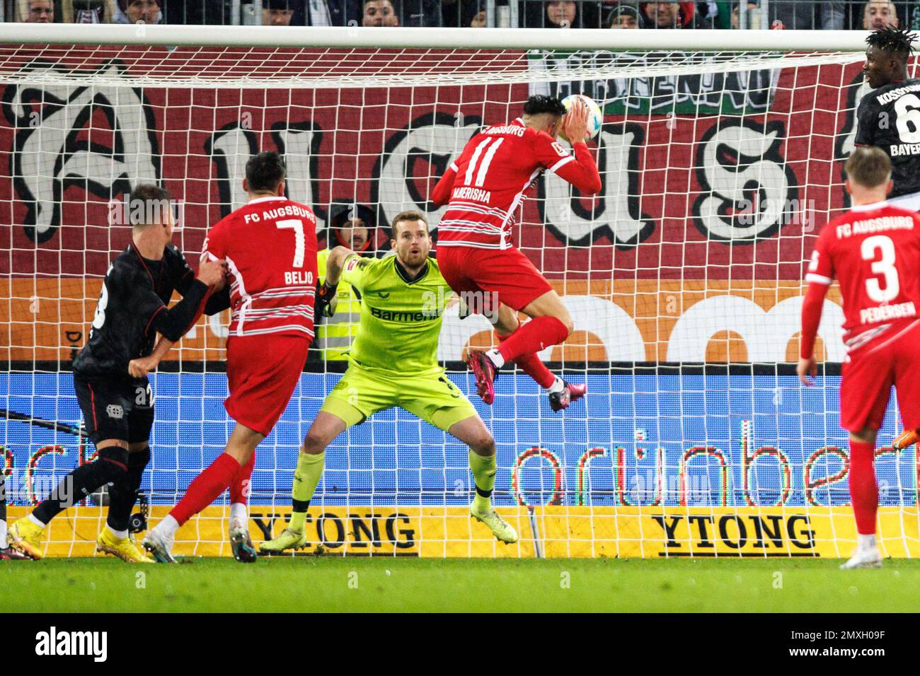 Augsburg, Germany. 03rd Feb, 2023. Soccer: Bundesliga, FC Augsburg - Bayer Leverkusen, Matchday 19, WWK Arena. FC Augsburg's Mergim Berisha (r) scores to make it 1:0. Bayer Leverkusen goalkeeper Lukas Hradecky, left, cannot keep out the ball. Credit: Matthias Balk/dpa - IMPORTANT NOTE: In accordance with the requirements of the DFL Deutsche Fußball Liga and the DFB Deutscher Fußball-Bund, it is prohibited to use or have used photographs taken in the stadium and/or of the match in the form of sequence pictures and/or video-like photo series./dpa/Alamy Live News Stock Photo