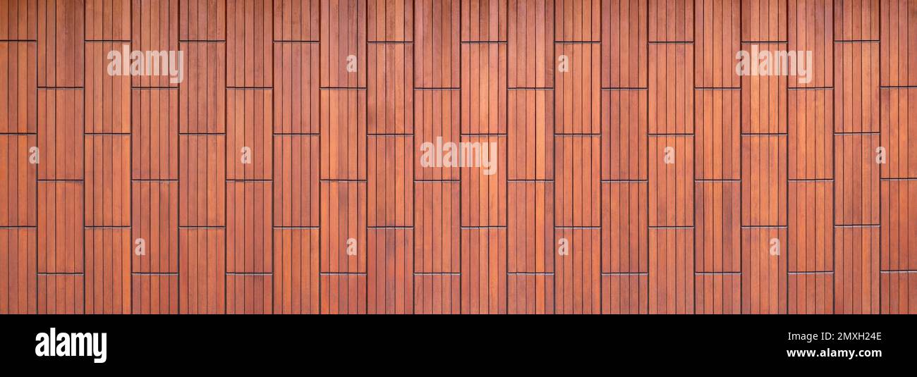 Brown wood paneling made of vertical coffers with pattern of wooden battens Stock Photo