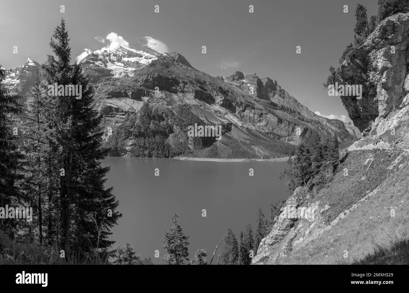 The Oeschinensee lake and the peaks Doldenhorn, Frundenhorn, Oeschinenhorn in Bernese alps. Stock Photo