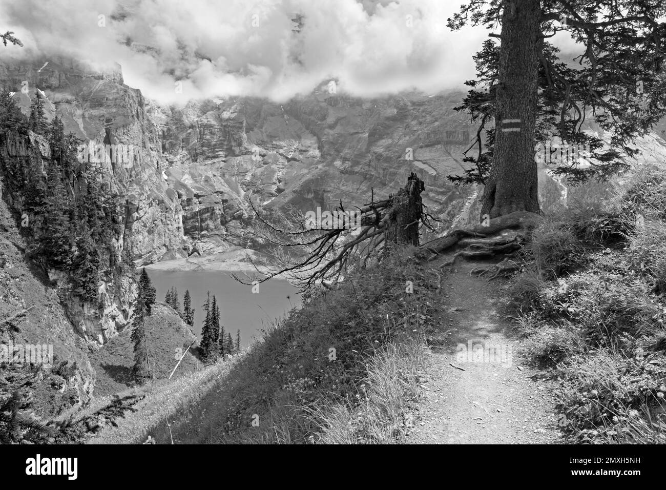 The Oeschinensee lake and the peaks Doldenhorn, Frundenhorn, Oeschinenhorn in Bernese alps. Stock Photo