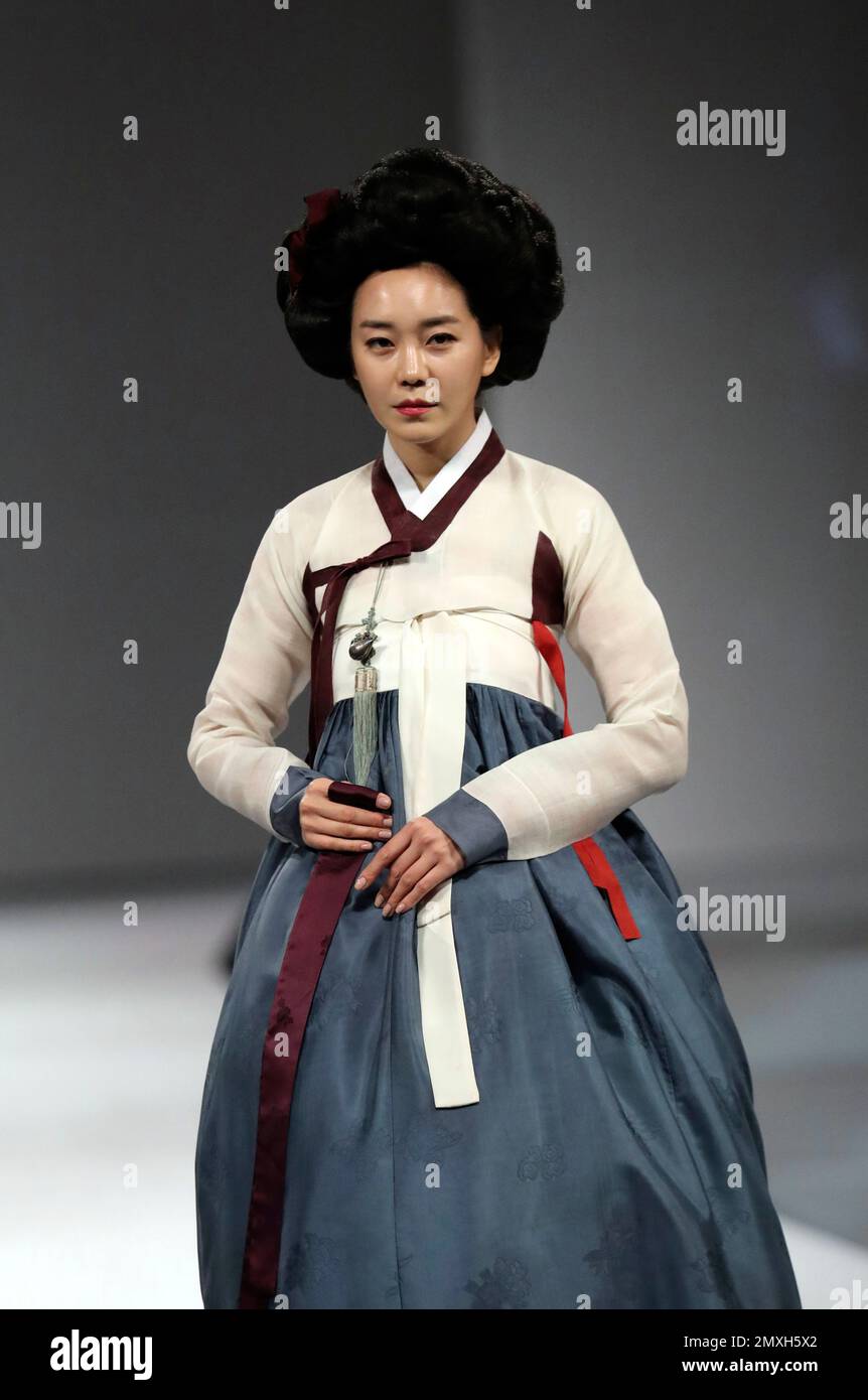 A model wears a traditional South Korean "Hanbok" dress during a Hanbok