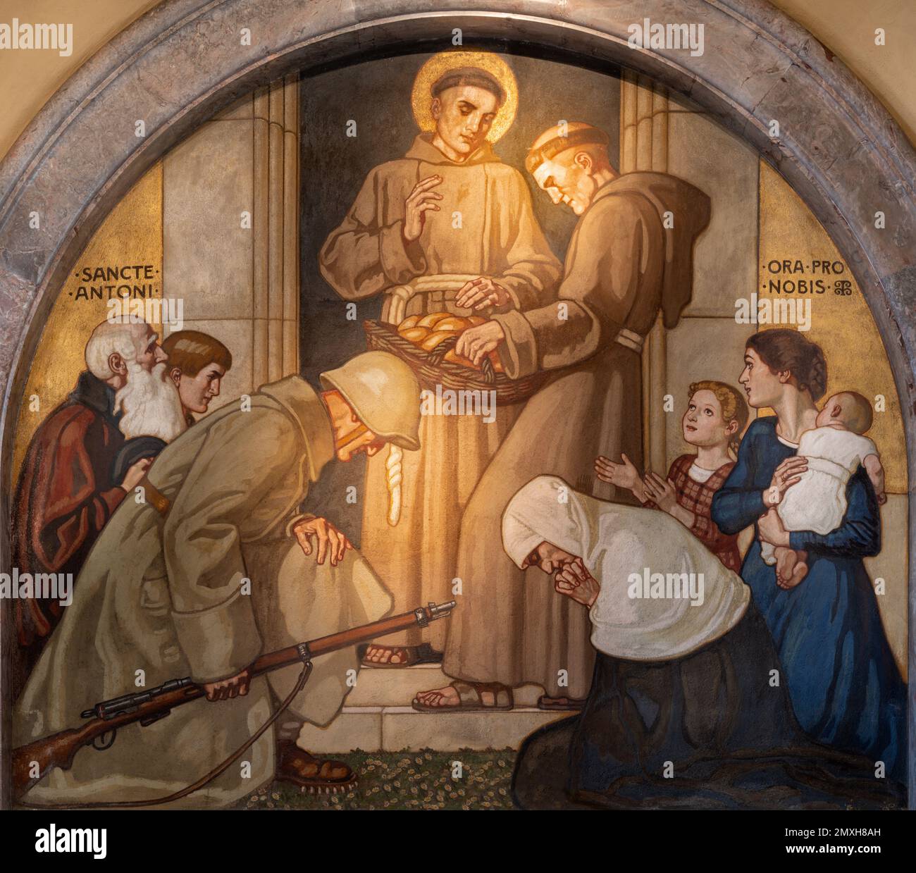 ZURICH, SWITZERLAND - JULY 1, 2022: The fresco St. Anthony of Padua distributing bread in the church St. Anton by Fritz Kunz (1921). Stock Photo