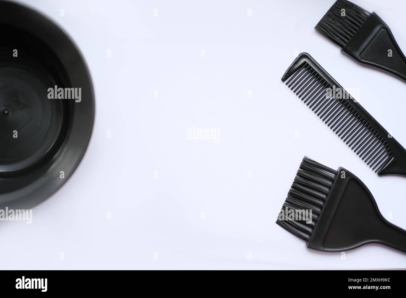 Top view, flat lay, hair coloring accessories, brushes and combs