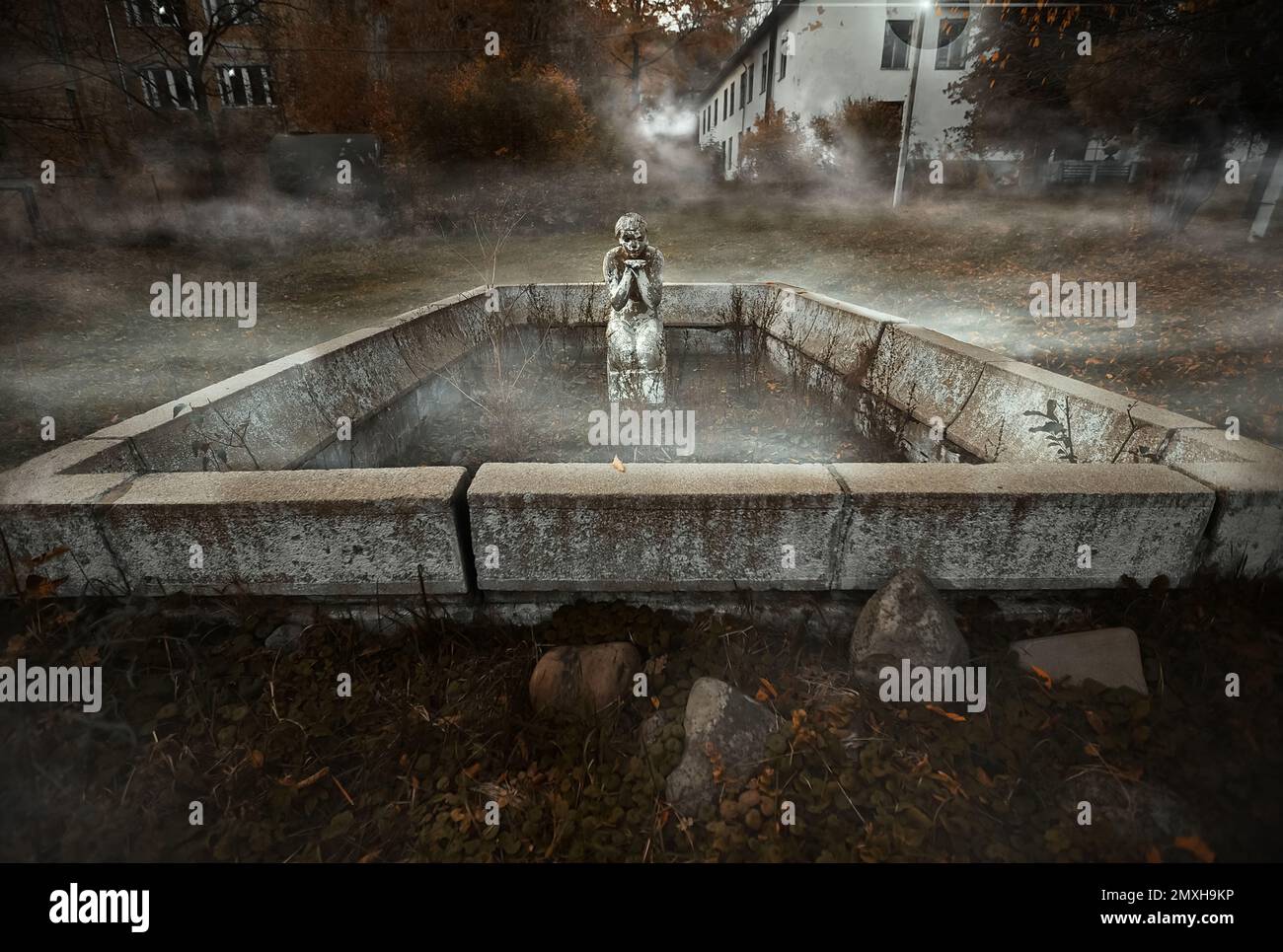 Lost place. Forgotten monument. Broken fountain. Abandoned resort. Rain and wind, flying leaves. Lonely houses. Fog among the trees. Forgotten in the forest. High quality photo Stock Photo