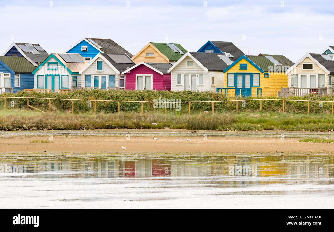 Row of beach houses, holiday homes at the coast on Hengistbury Head Stock Photo