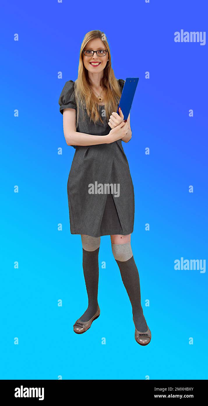 Young beautiful woman holding clip pad in hands and getting ready for presentation Stock Photo
