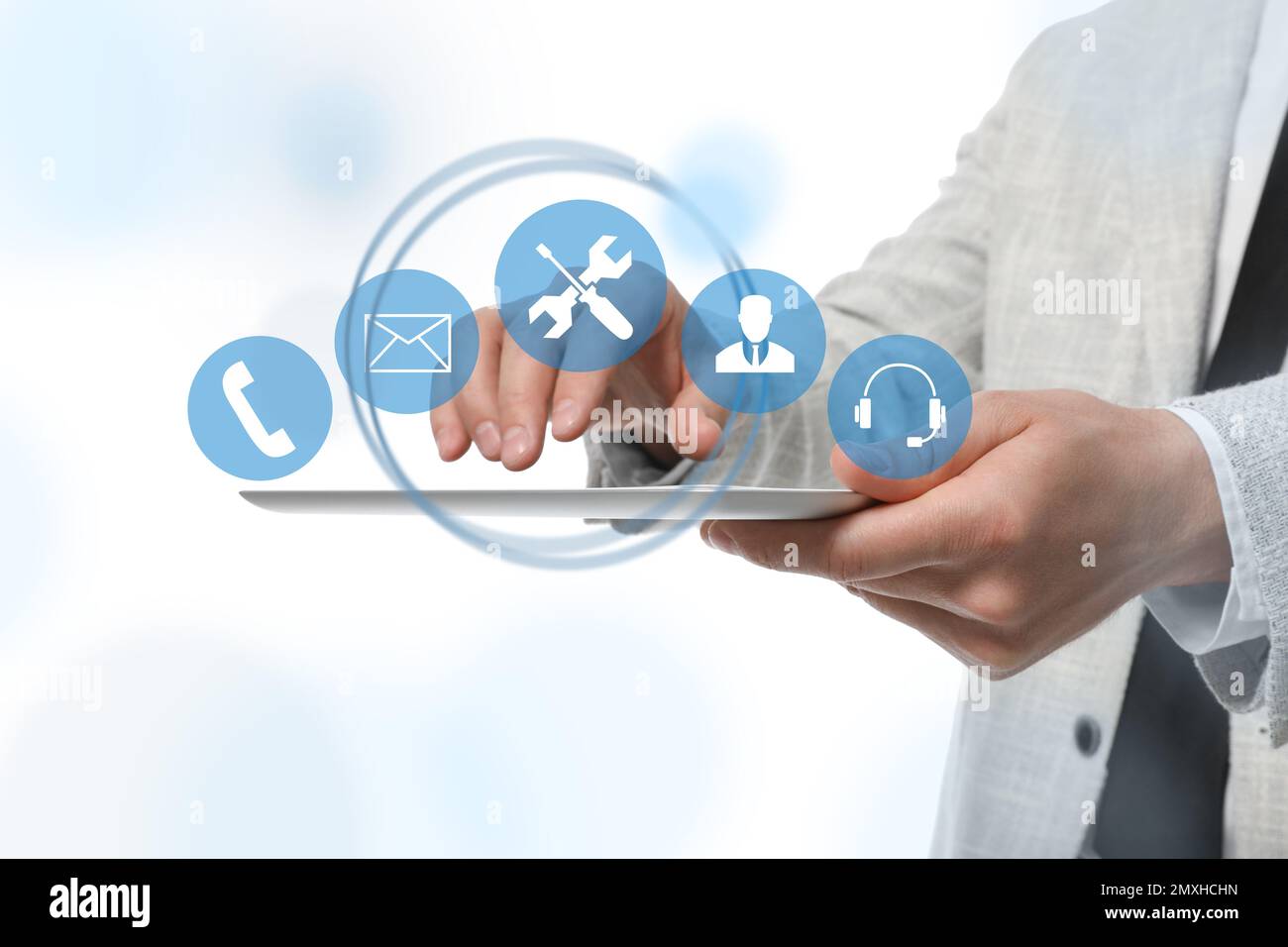 Man using tablet on white background, closeup. Technical support Stock Photo