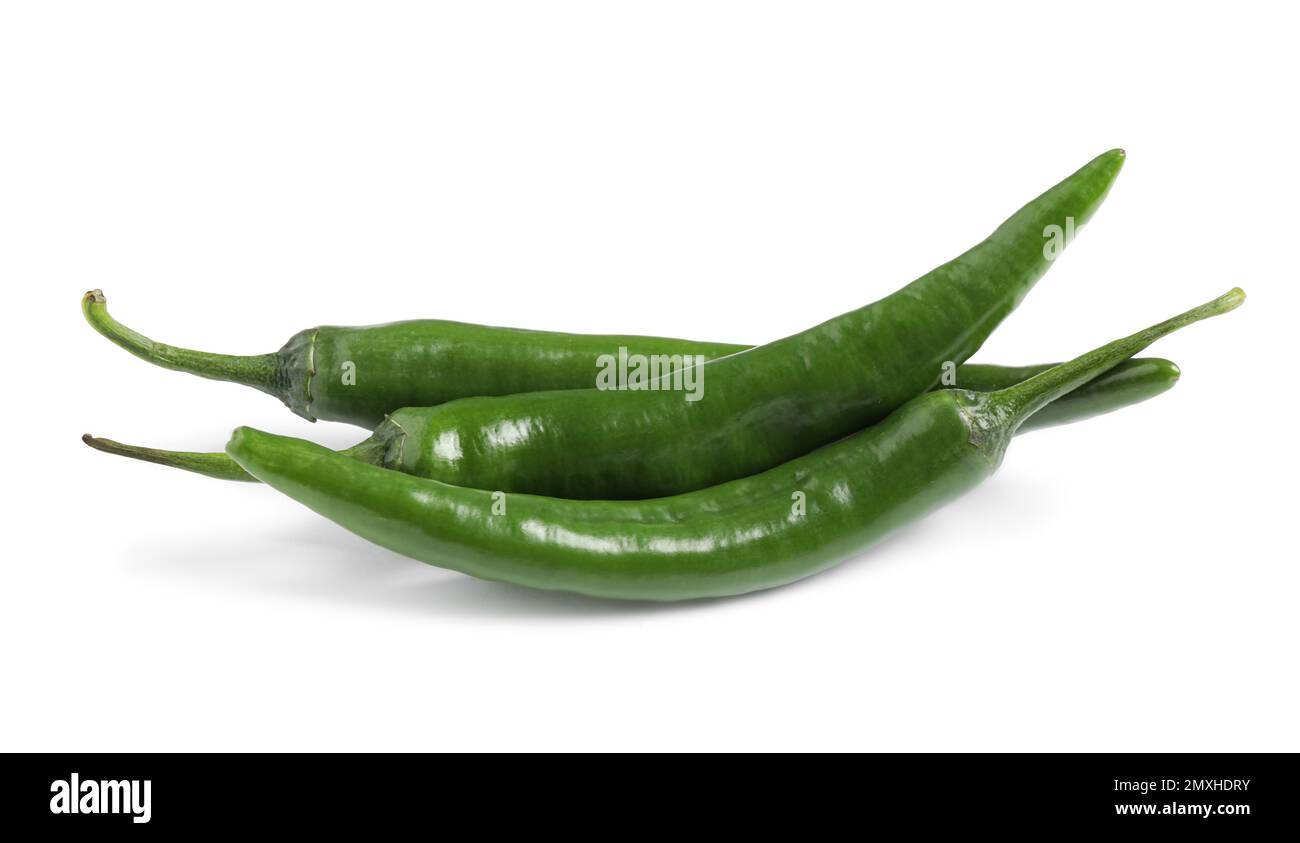 Green hot chili peppers on white background Stock Photo - Alamy