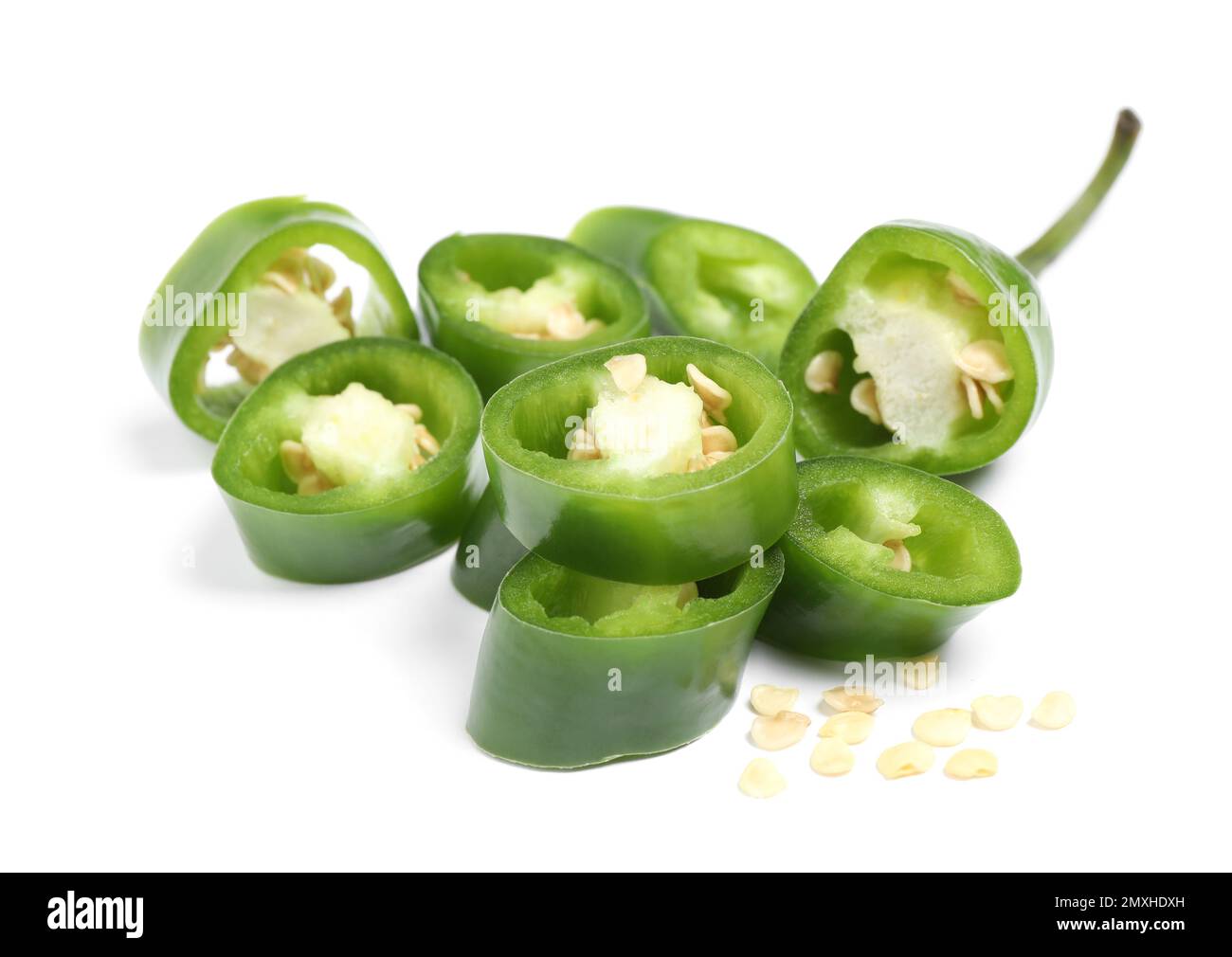 Cut green hot chili pepper on white background Stock Photo - Alamy
