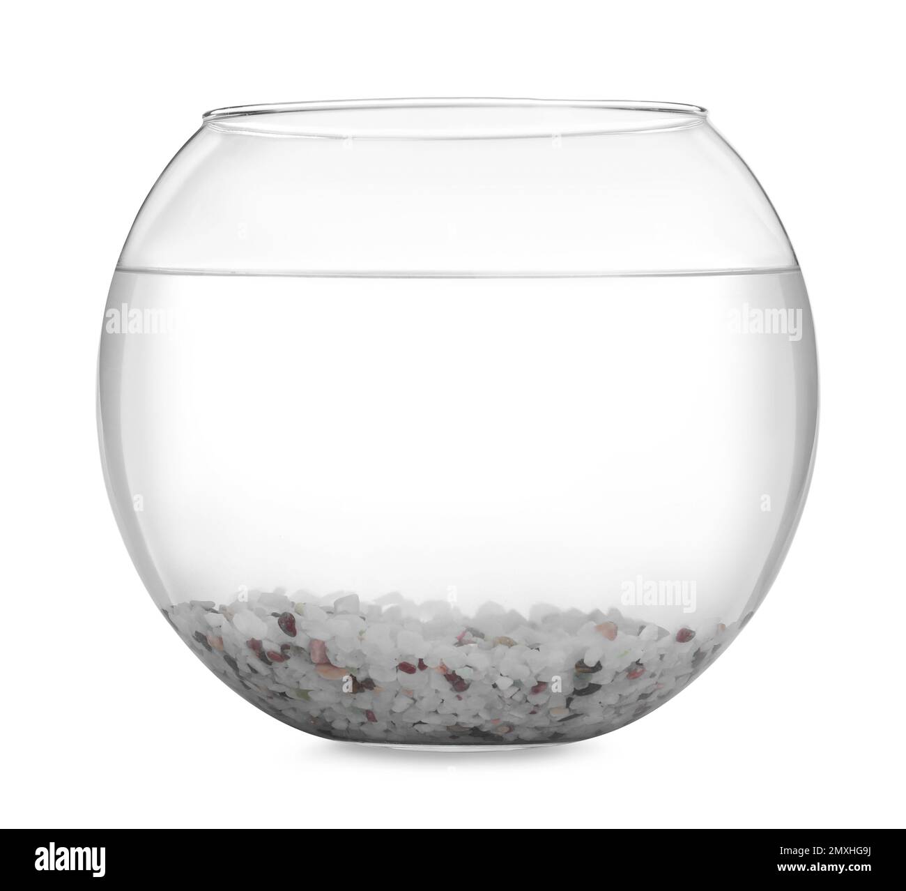 Glass fish bowl with clear water and decorative pebble isolated on