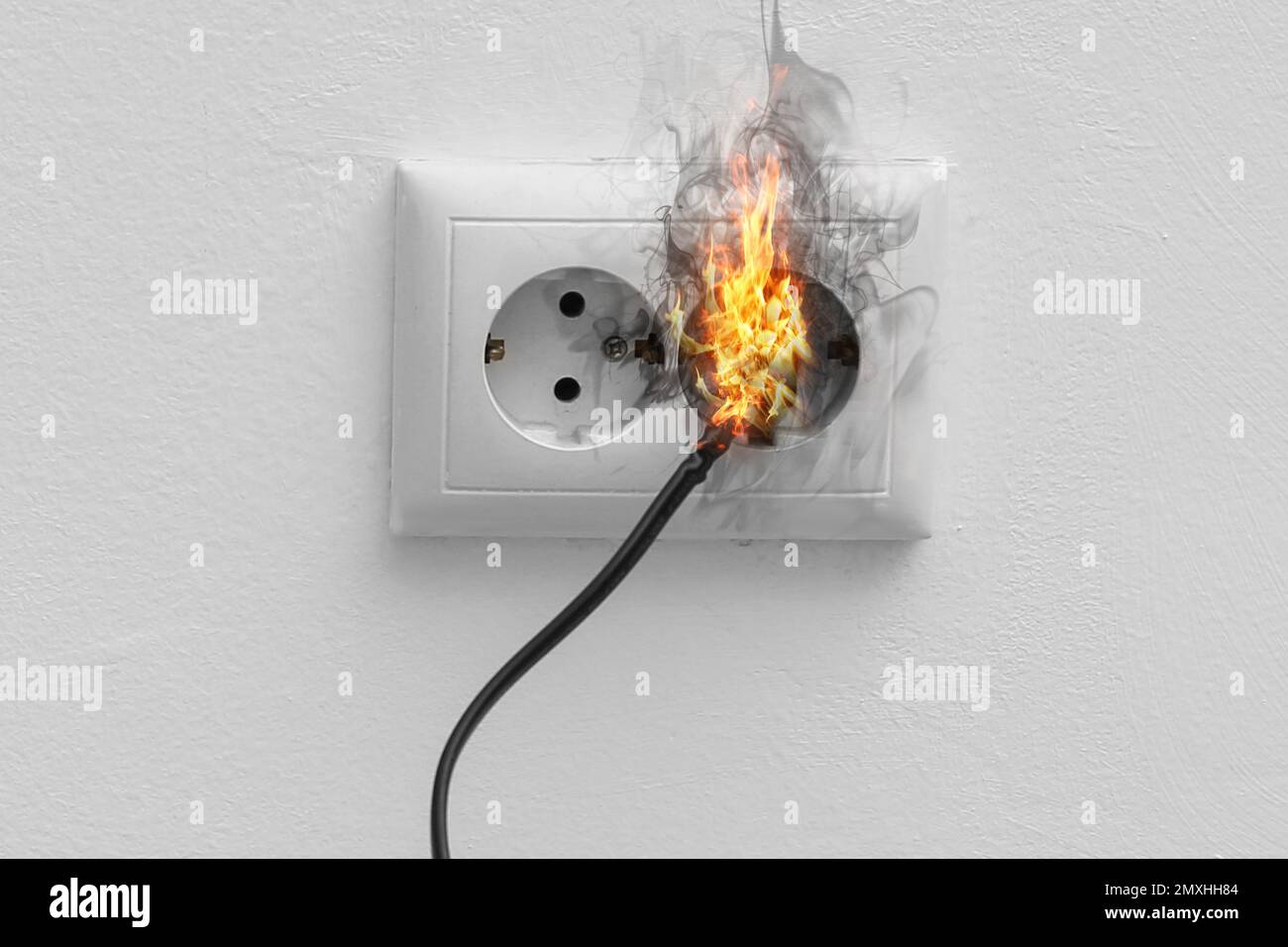 Electrical short circuit leading to plug ignition Stock Photo Alamy