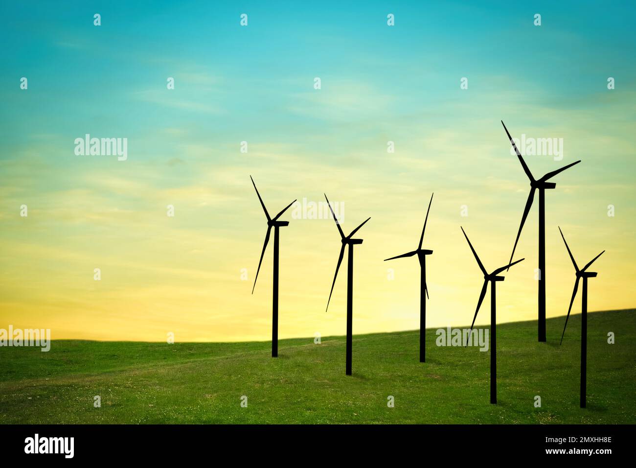 Silhouettes of wind turbines at sunset. Alternative energy source Stock ...