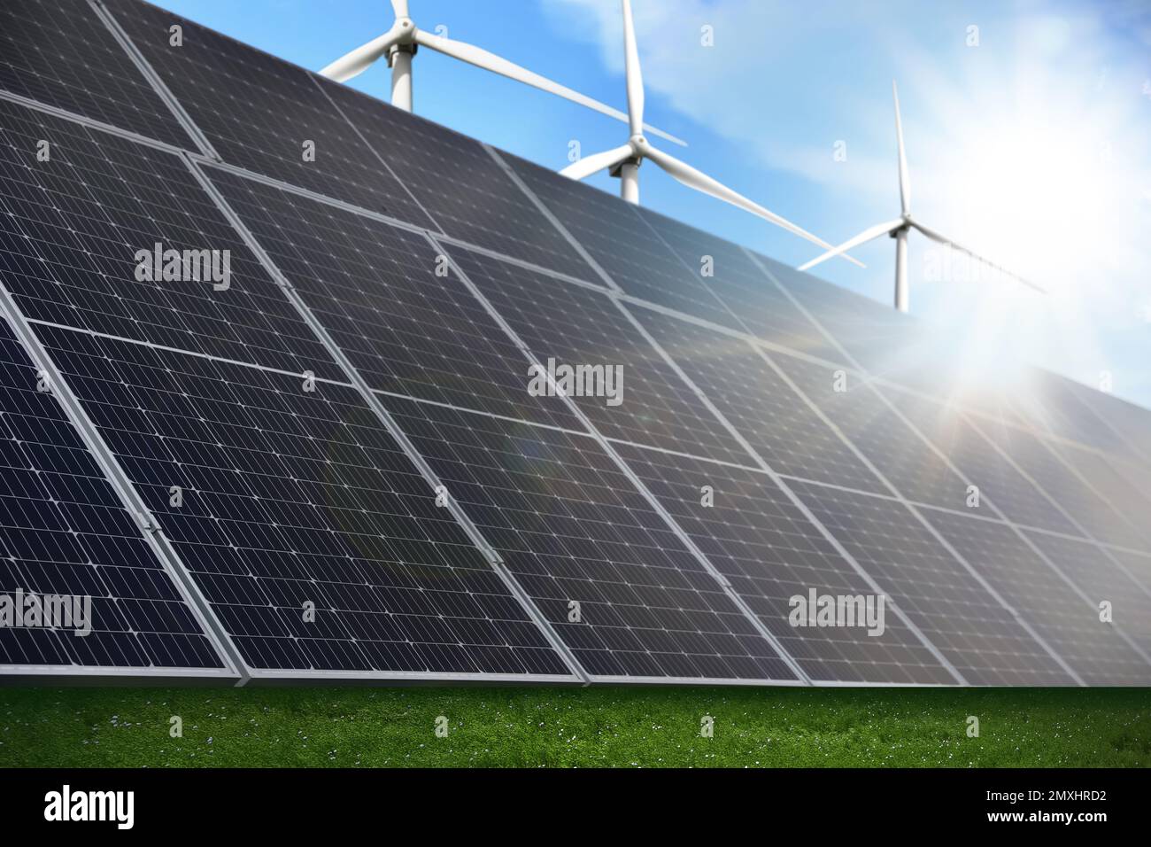 Solar panels and wind turbines installed outdoors. Alternative energy ...