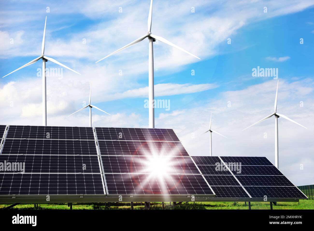Solar panels and wind turbines installed outdoors. Alternative energy ...