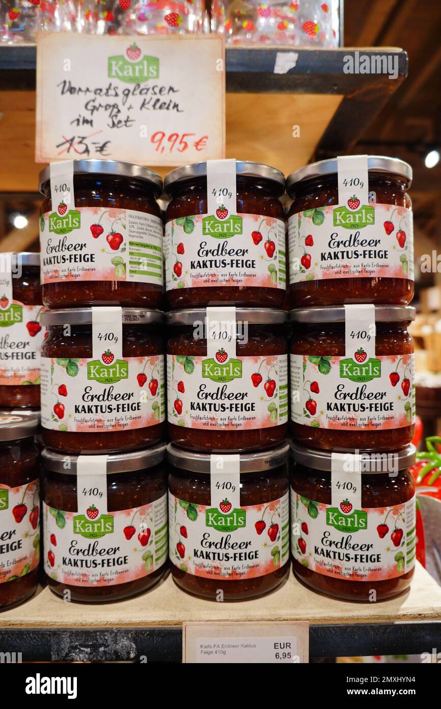 Stacked strawberry jam jars for sale in Karl's Adventure Village in