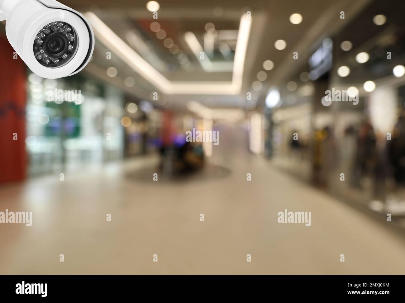 Modern CCTV security camera in shopping mall. Guard equipment Stock