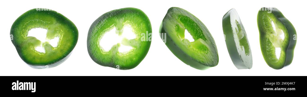 Green hot chili pepper pieces on white background Stock Photo - Alamy