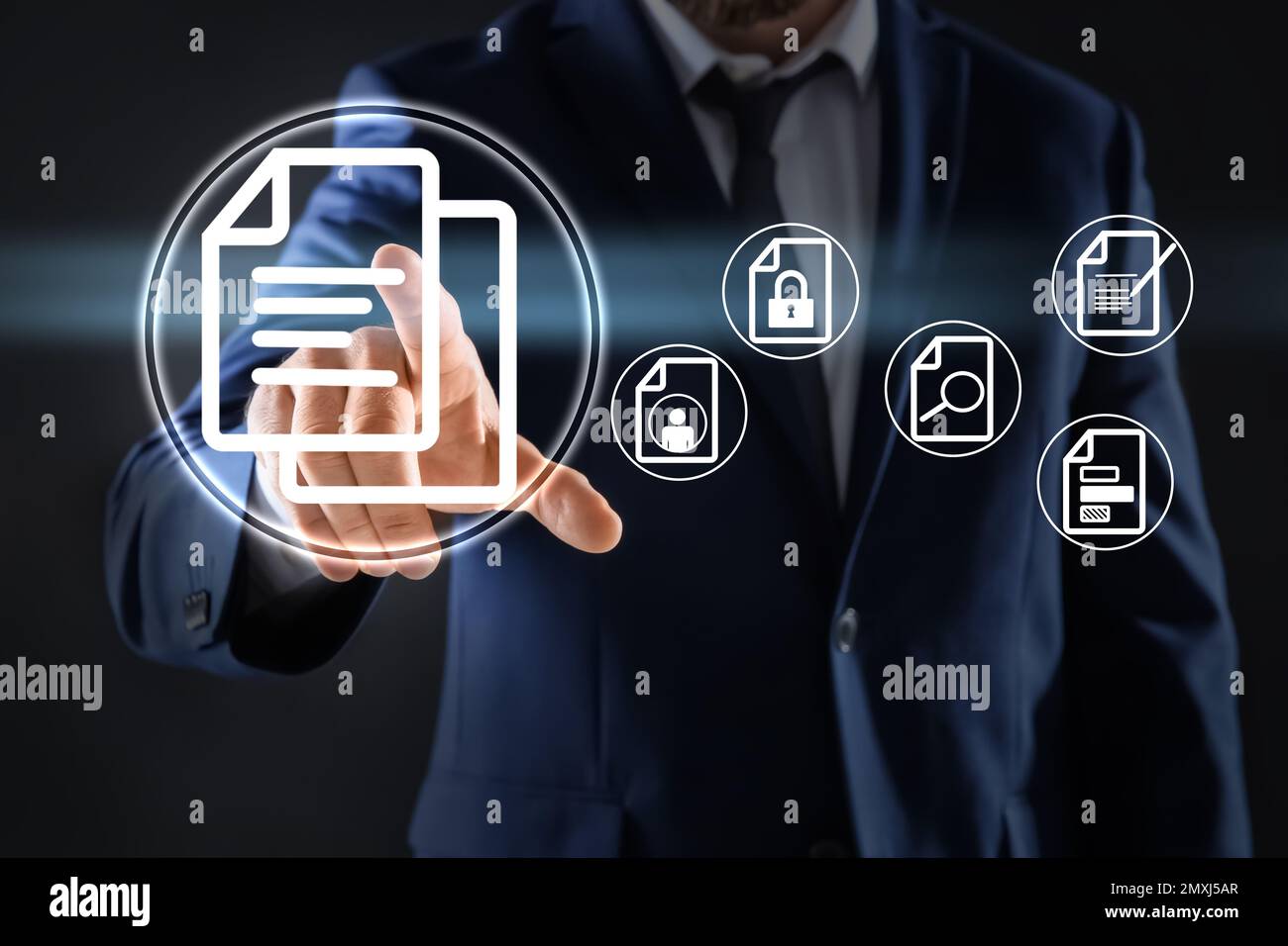Man pointing at document icon on virtual screen, closeup Stock Photo