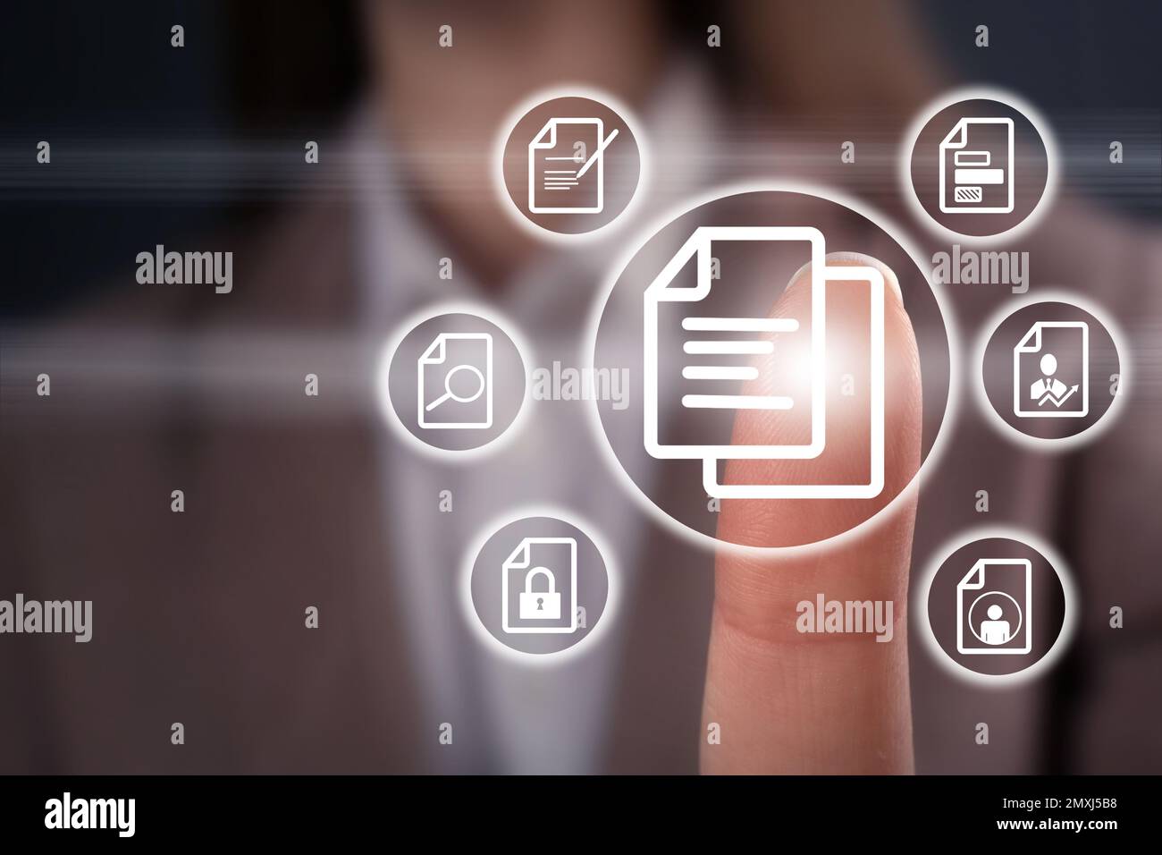 Woman pointing at document icon on virtual screen, closeup Stock Photo