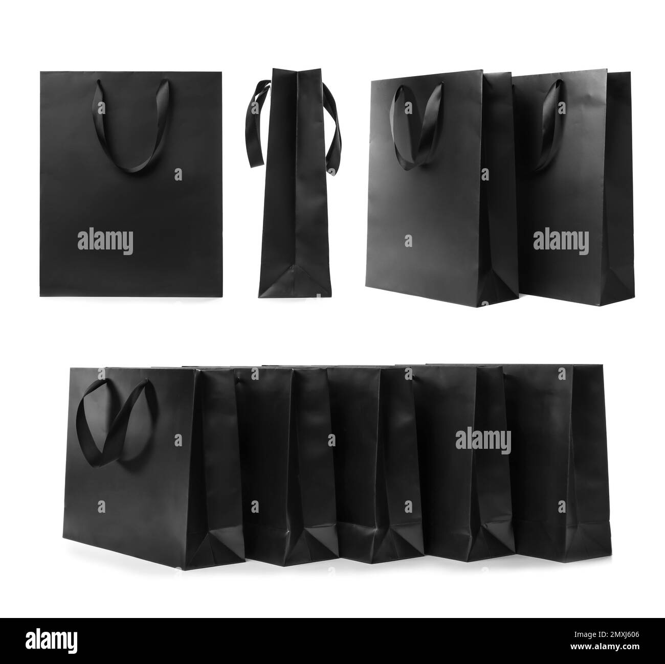 Set with black paper shopping bags on white background Stock Photo - Alamy