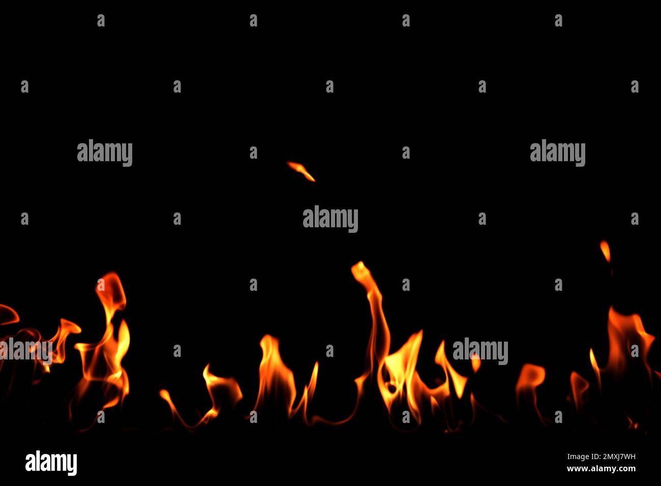 Beautiful bright fire flames on black background Stock Photo - Alamy
