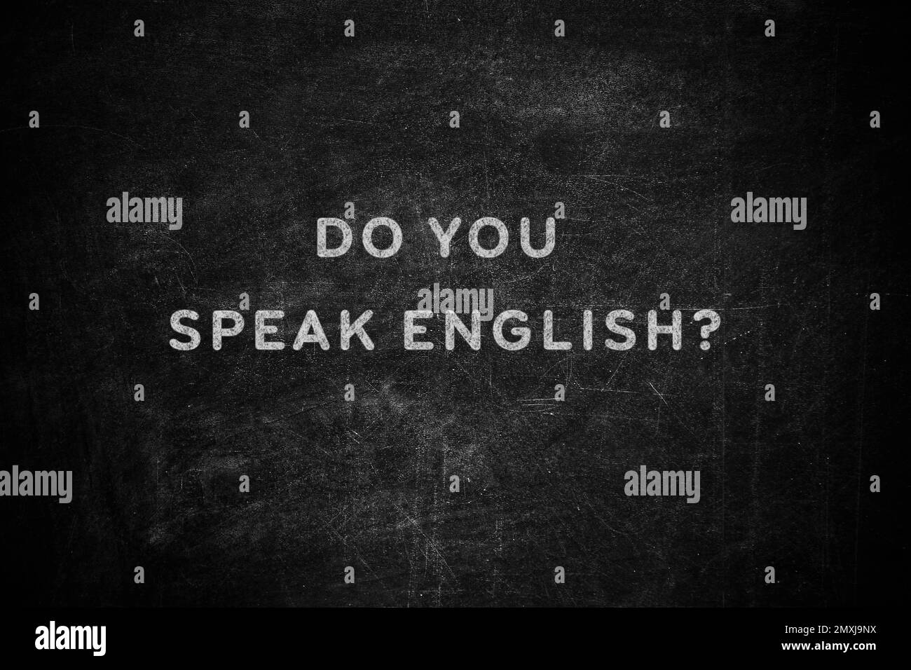 Black chalkboard with text Do You Speak English Stock Photo