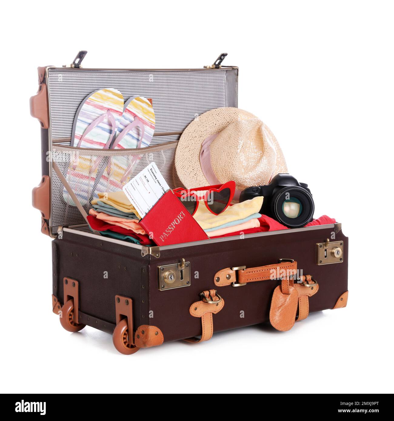 Open vintage suitcase with clothes packed for summer vacation isolated ...