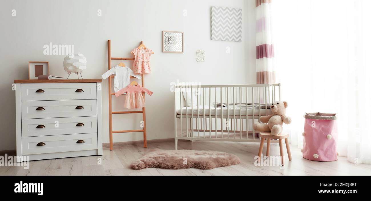 Baby room interior with comfortable crib. Banner design Stock Photo - Alamy
