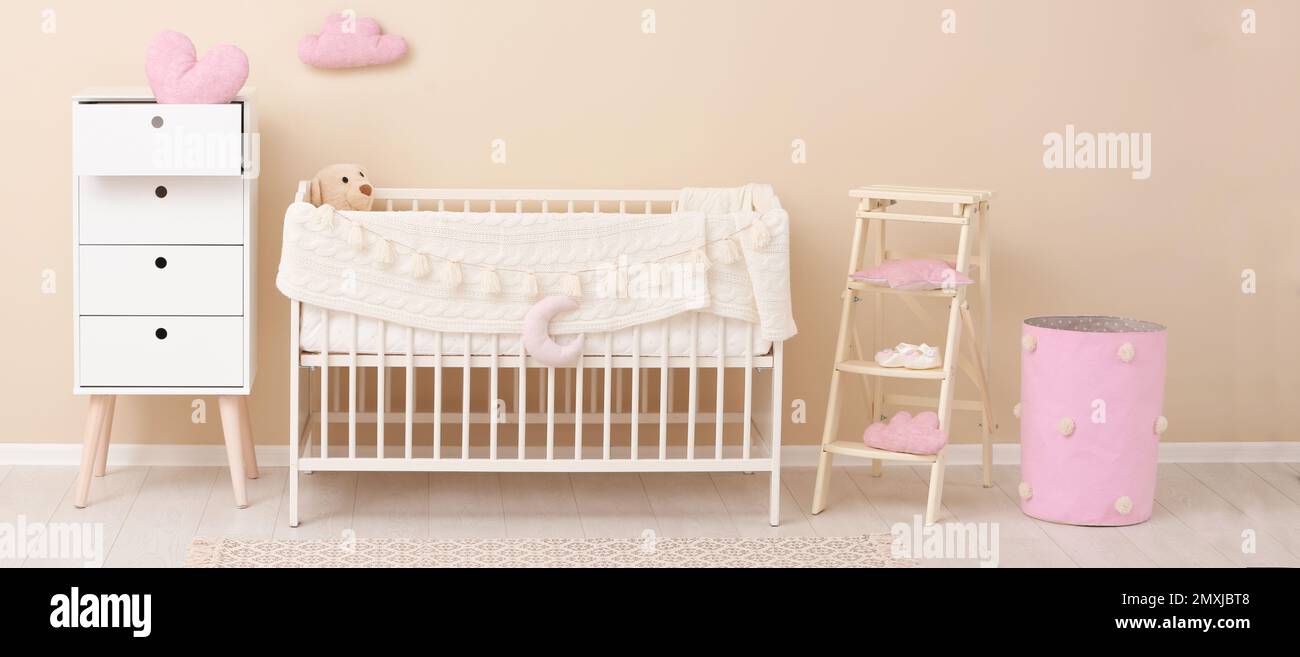 Baby room interior with comfortable crib. Banner design Stock Photo - Alamy