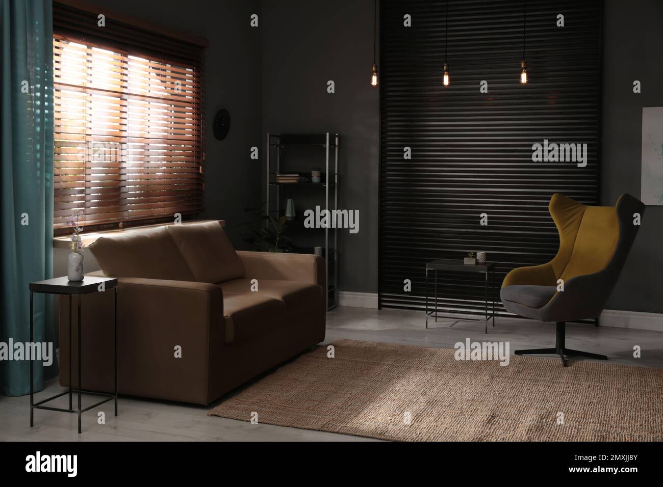 Stylish living room interior with elegant leather sofa and armchair ...