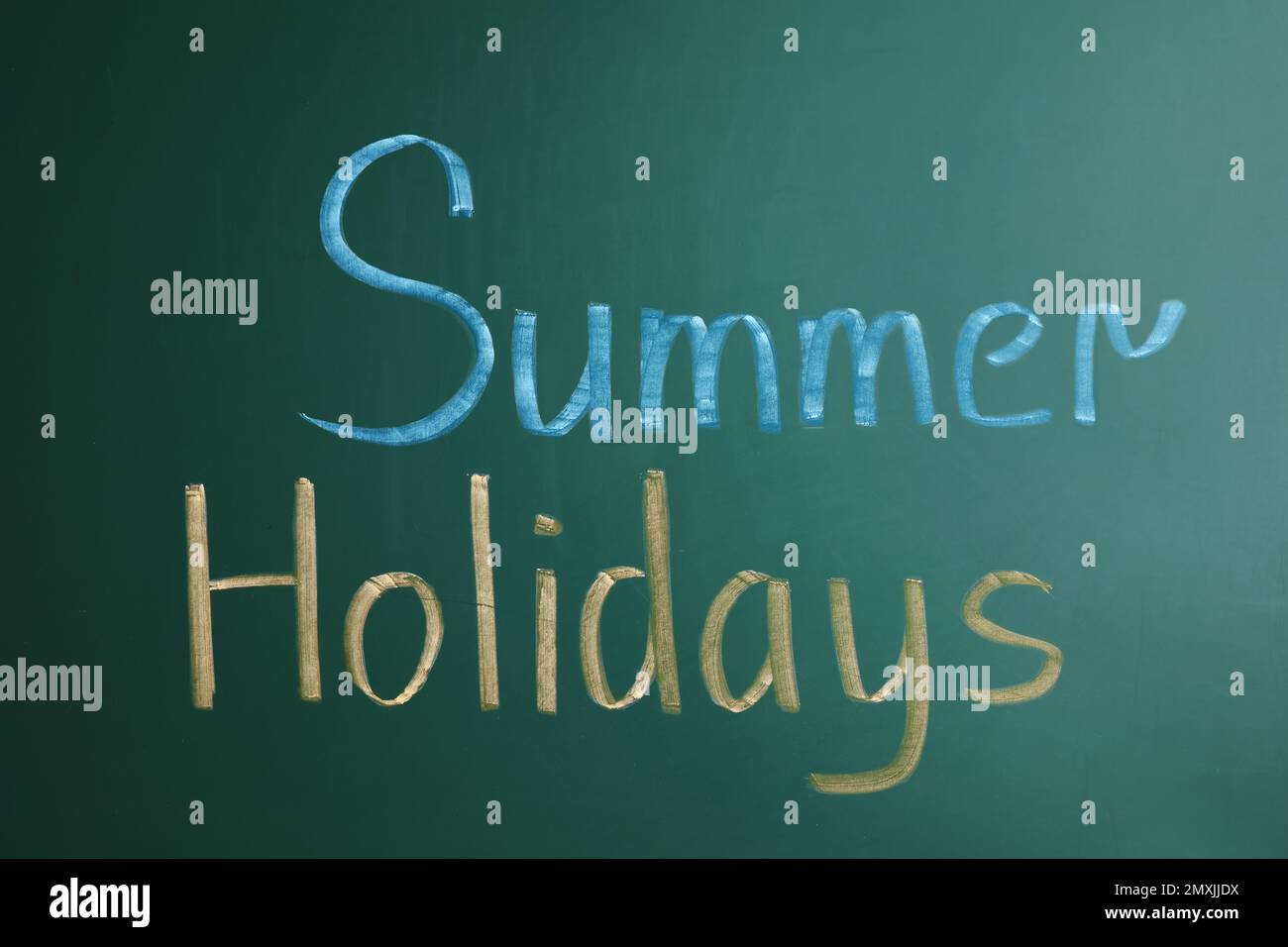 Text Summer Holidays written on school chalkboard Stock Photo - Alamy