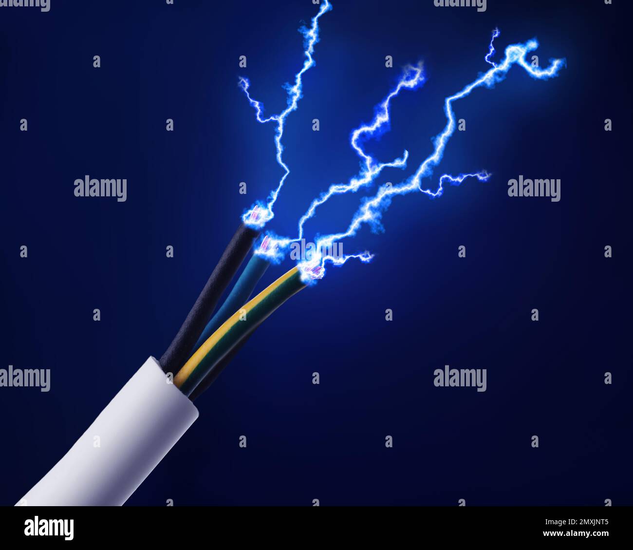 Sparking cables on dark blue background, closeup. Electrician's supply Stock Photo