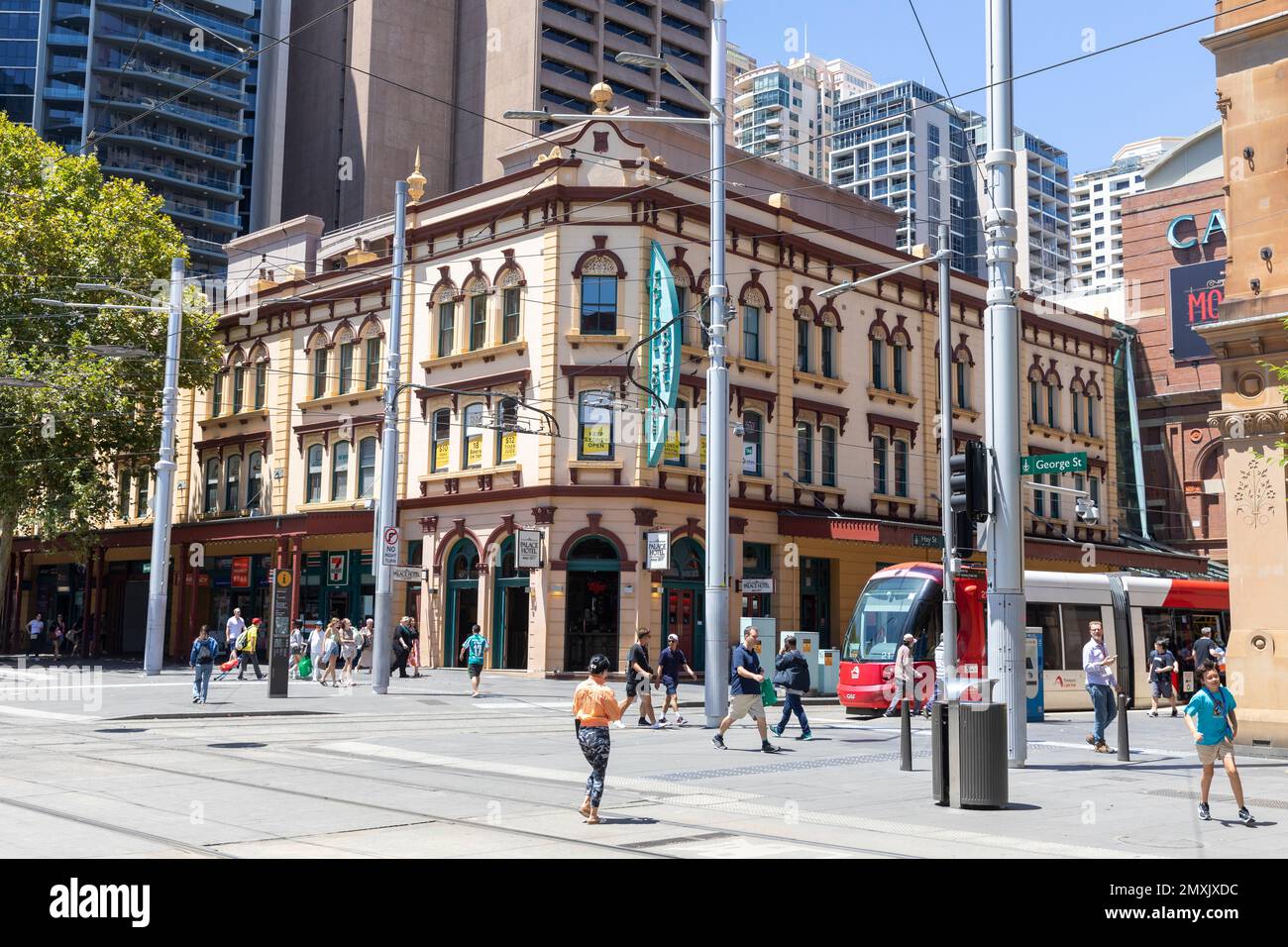 Sydney city centre, The Palace Hotel on George street with Light rail train travelling along Hay street,Haymarket,Sydney city centre, NSW,Australia Stock Photo