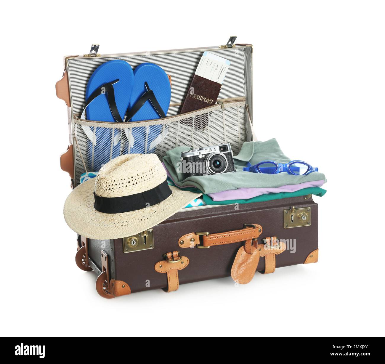 Open vintage suitcase with clothes packed for summer vacation isolated ...