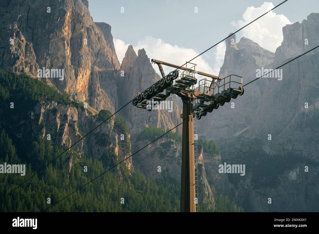 A low-angle of Palm Springs aerial tramway with a sunny and misty mountains and sky background Stock Photo