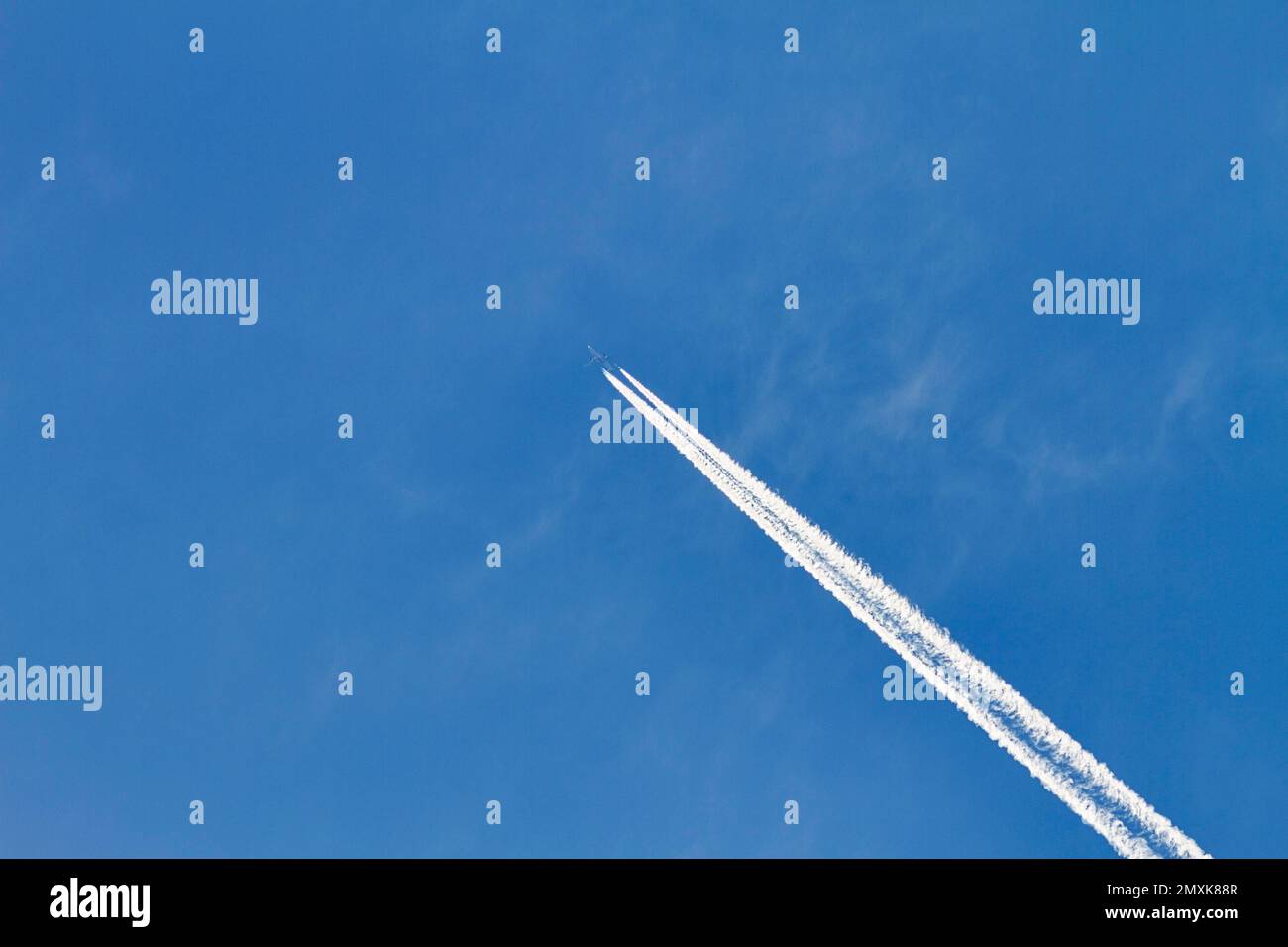 Contrails in the blue sky, Germany, Europe Stock Photo