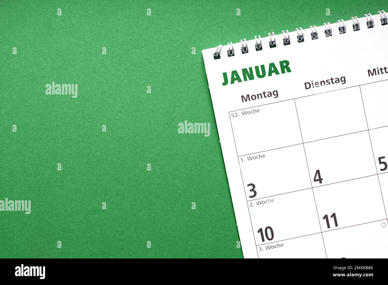 german calendar for the month january on green paper background with copy space Stock Photo