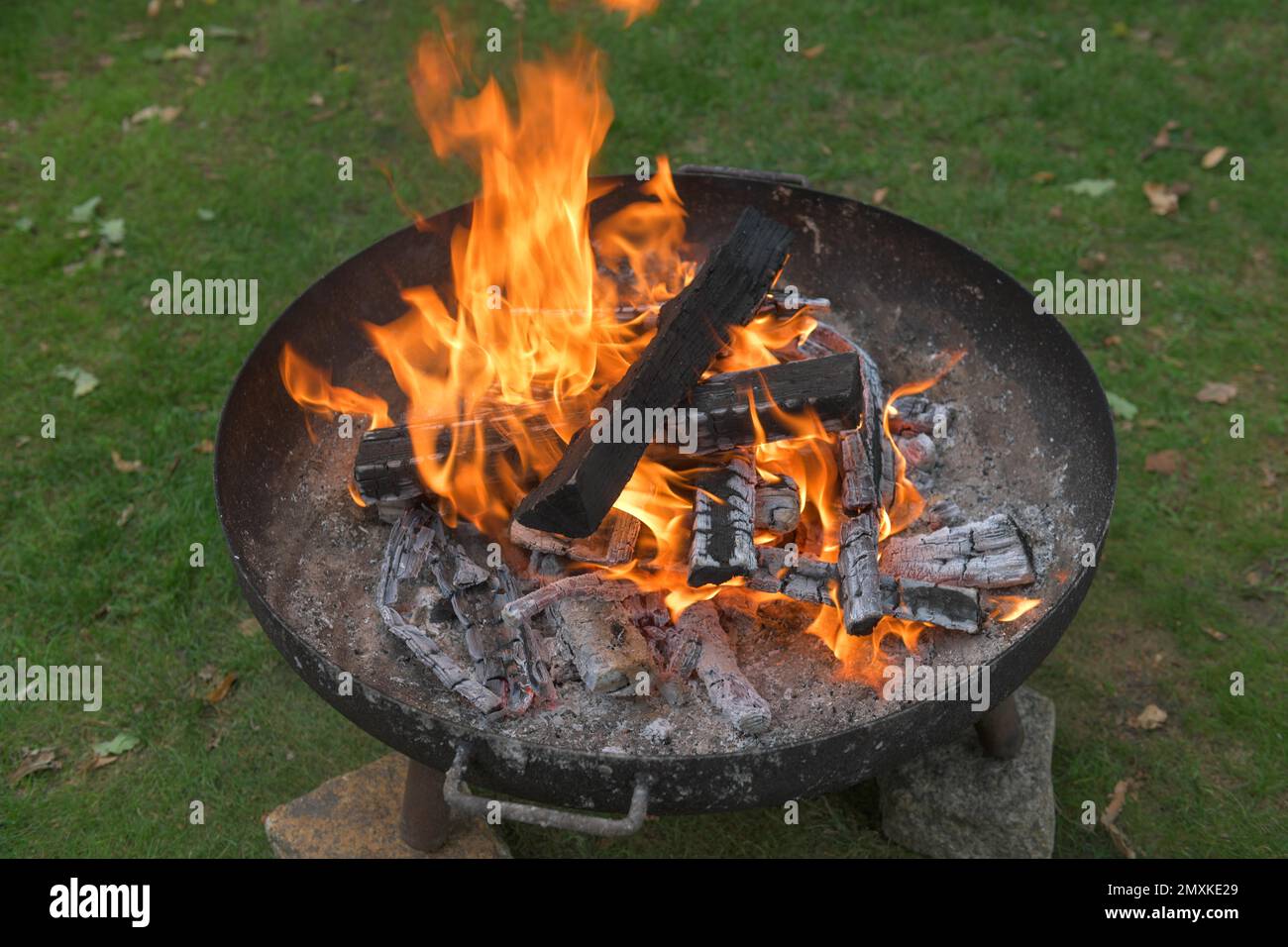 Fire bowl with burning wood fire, flames Stock Photo Alamy
